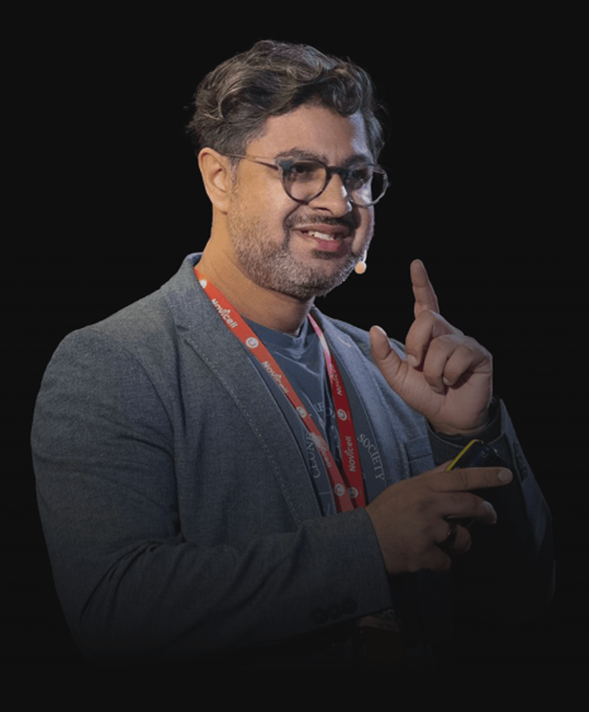 Ash Ali pointing up and presenting